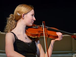 Elizabeth Mae playing violin in Middle school